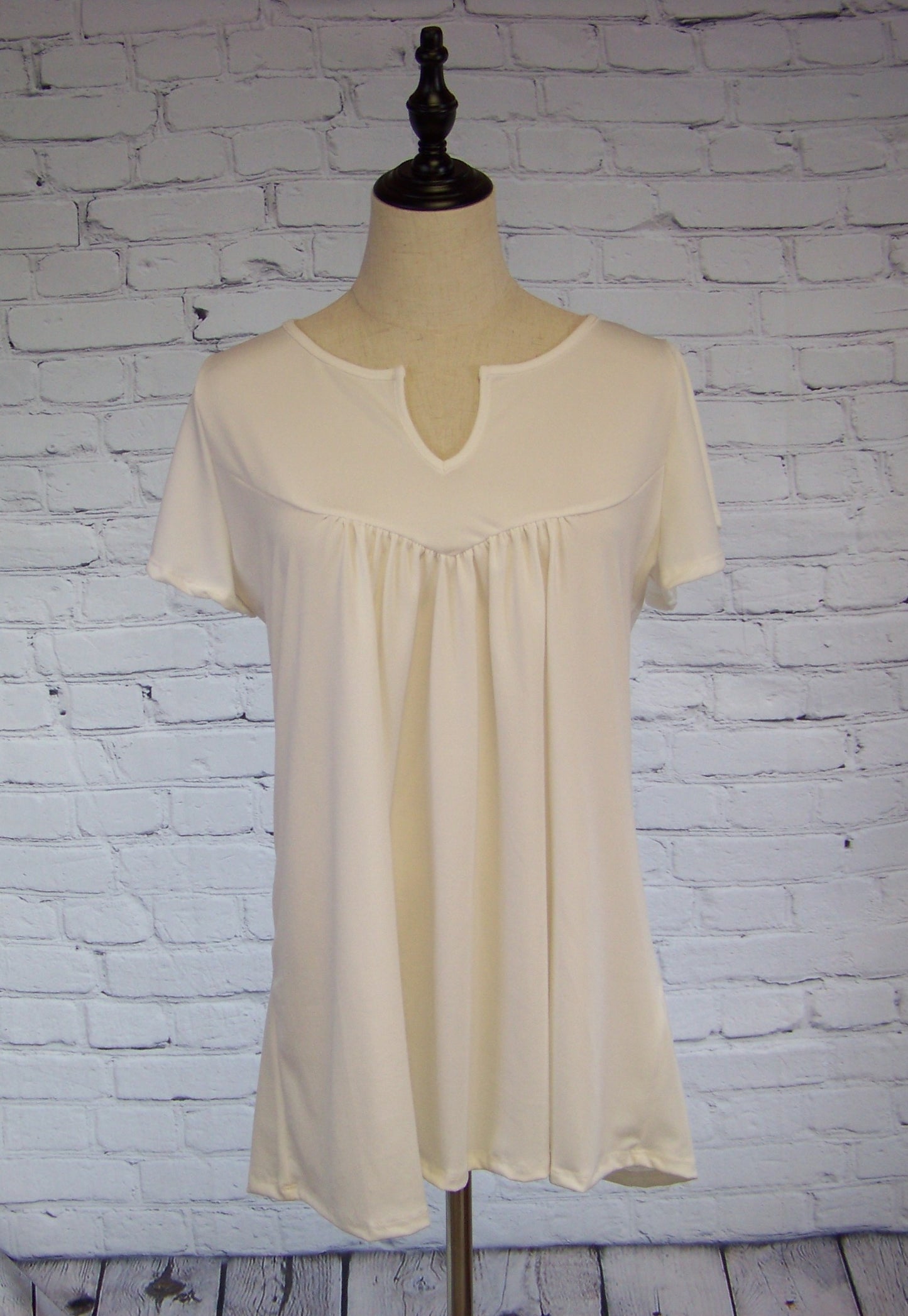 Baby doll Knit Top with Notched Neck Line - Corinne's Boutique